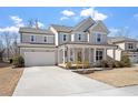 Beautiful home with an attached two-car garage and covered front porch, plus a long driveway at 3021 Falco Field Ln, Fuquay Varina, NC 27526