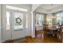 Bright foyer and dining area, hardwood floors, and abundant natural light at 338 Wildwind Dr, Chapel Hill, NC 27516