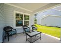 Cozy outdoor porch featuring comfortable seating, perfect for relaxing and enjoying the surrounding views at 340 Olde Liberty Dr, Youngsville, NC 27596