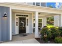 Inviting front porch with ample space for seating, decorative wreaths, and a tranquil ambiance at 340 Olde Liberty Dr, Youngsville, NC 27596