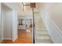 Grand foyer with staircase, hardwood floors, and views into the living spaces at 3924 Sunset Maple Ct, Raleigh, NC 27612