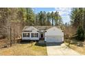 Attractive single Gathering home with an attached 2-car garage and well manicured front yard at 40 Paddle Wheel Ct, Franklinton, NC 27525