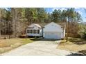Attractive single Gathering home with an attached 2-car garage and well manicured front yard at 40 Paddle Wheel Ct, Franklinton, NC 27525