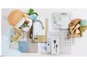 An artistic display of kitchen components, complete with a basket of food and wine and flowers at 504 Yeowell Dr, Chapel Hill, NC 27514