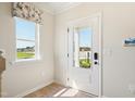 Welcoming entryway featuring a window and a view of the outdoors at 52 Commons Cir, Clayton, NC 27520