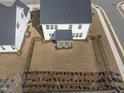 Aerial view of a backyard enclosed with a black metal fence and a screened in porch at 652 Marion Hills Way, Knightdale, NC 27545