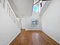 Bright living room with high ceilings, fresh paint, and hardwood floors at 8209 Rolling Glenn Dr, Raleigh, NC 27616