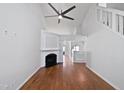Bright living room with fireplace, fresh paint, and hardwood floors at 8209 Rolling Glenn Dr, Raleigh, NC 27616