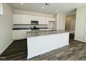 Stylish kitchen featuring a large island, stainless steel appliances, and granite countertops at 83 Commons Cir # 236, Clayton, NC 27520
