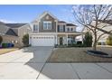 Beautiful two-story home with a well-manicured lawn and attached two car garage at 917 Sequoia Ridge Dr, Fuquay Varina, NC 27526