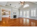 Spacious living room with vaulted ceilings, fireplace, and hardwood floors at 215 Oak Island Ct, Garner, NC 27529