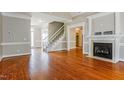 Bright and airy living room featuring a fireplace and hardwood floors at 215 Oak Island Ct, Garner, NC 27529