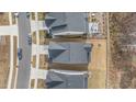 An aerial view of the home's roof and backyard, including a patio with outdoor seating at 2212 Jollay St, Durham, NC 27703