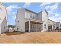 Spacious backyard with a screened-in porch providing a cozy outdoor living space at 2212 Jollay St, Durham, NC 27703