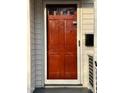 The front door is a wooden door with a glass pane at the top at 2409 Shenandoah Ave, Durham, NC 27704