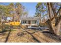 Attractive single-story home featuring fresh landscaping, quaint porch, and a beautifully maintained front yard at 318 Holland Glen St, Fuquay Varina, NC 27526