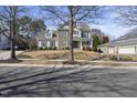 Traditional two-story home with manicured lawn and mature trees at 324 Stearns Way, Wake Forest, NC 27587