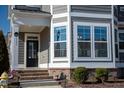 Elegant front entrance with a black door, brick steps, and white trim at 5501 Advancing Ave, Raleigh, NC 27616