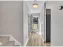 Bright entryway features wood flooring and neutral paint, leading into the home's living spaces at 6036 Epping Forest Dr, Raleigh, NC 27613