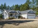 Charming single-Gathering home with a welcoming front porch and well-maintained landscaping at 66 Shetland Ln, Smithfield, NC 27577
