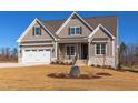 Charming single-Gathering home with a two-car garage and craftsman-style details on a sunny day at 75 Harvest View Way, Franklinton, NC 27525