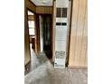 Interior view of a home featuring a large, vintage heater and wood paneled walls at 750 David St, Henderson, NC 27536
