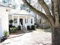 Inviting home exterior featuring a cozy front porch and landscaped yard at 8 Weeping Beech Way, Durham, NC 27713