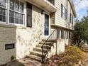 Front door with black shutters, and green painted brick at 1195 Champion Dr, Cary, NC 27511