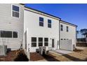View of the back of the property showing its light siding, patio area, and fenced in yard at 2004 Regal Dr # 86, Durham, NC 27703