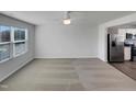 Bright, open floorplan living room with neutral color palette, and stainless steel appliances at 2005 Silent Bend Dr, Durham, NC 27704