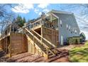 Multi-level deck with stairs and a covered section, providing ample outdoor living and entertaining space at 201 Sea Biscuit Lane, Apex, NC 27539