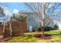 Large backyard deck with stairs and a covered section, perfect for outdoor relaxation at 201 Sea Biscuit Lane, Apex, NC 27539