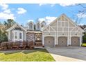 Charming home with stone accents, a three-car garage, and a well-maintained lawn and shrubs at 201 Sea Biscuit Lane, Apex, NC 27539