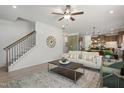 Open-concept living room with a cozy sofa, stylish coffee table, and hardwood floors at 219 E American Merigold Dr # 45, Benson, NC 27504