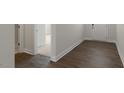 Inviting entryway featuring wood-look floors and white trim, seamlessly connecting to other living spaces at 273 Umstead St, Sanford, NC 27330