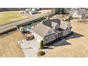 Aerial view of a home with a private backyard pool, mature landscaping, and basketball court at 29 Alban Row, Fuquay Varina, NC 27526