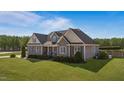 Attractive two-story home featuring a well-manicured lawn and inviting front porch at 29 Alban Row, Fuquay Varina, NC 27526