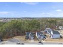 An aerial view showcasing the neighborhood and surrounding green spaces at 308 Harmony Creek Pl, Apex, NC 27539