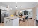 Open-concept kitchen flows into the dining area, creating a spacious and inviting atmosphere at 53 Mildred Pl, Broadway, NC 27505