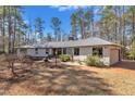 Beautiful single-story home with manicured lawn, brick pathway, attached garage, and an American flag at 723 Chelsea Dr, Sanford, NC 27332