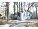 Charming gray home with a view of the backyard and a newly stained rear porch at 8125 Middleton Rd, Garner, NC 27529