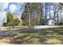 Beautiful big front yard with established trees surrounding this charming home at 8125 Middleton Rd, Garner, NC 27529