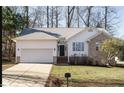 Charming single Gathering home with attached garage, manicured lawn, and a welcoming entrance at 100 W Acres Cres, Cary, NC 27519
