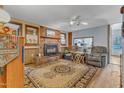 Comfortable living area features a brick fireplace, plush seating, and decorative area rug at 217 Stephen Taylor Rd, Wake Forest, NC 27587