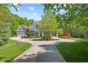 Beautiful residence showcases meticulous landscaping and a welcoming circular driveway at 219 Colvard Park Dr, Durham, NC 27713