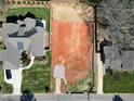 Aerial view of a vacant lot with a neighboring home showcasing its location and surrounding area at 405 Latimer Rd, Raleigh, NC 27609