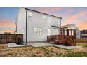 Exterior view of a home featuring a wooden deck and patio at 4412 Beckel Rd, Willow Springs, NC 27592
