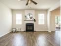 Cozy living room with a fireplace, hardwood floors, and natural light at 50 Dover Ridge Ct, Chapel Hill, NC 27517