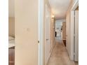 Hallway with neutral walls, carpeting, and doorways leading to other rooms in the house at 5816 Pointer Dr # 102, Raleigh, NC 27609