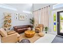 Comfortable living area with high ceilings, neutral tones, and modern furnishings at 601 Lee St, Durham, NC 27701